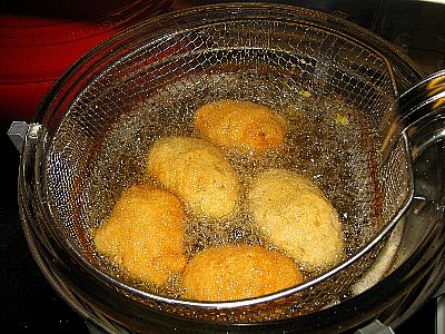 Arancini being fried